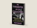 The Typewriter and the Guillotine: An American Journalist, a German Serial Killer, and Paris on the Eve of WWII by Mark Braude | barcode:9781538767139 | source:'9781538767139-right-three-quarter.jpg