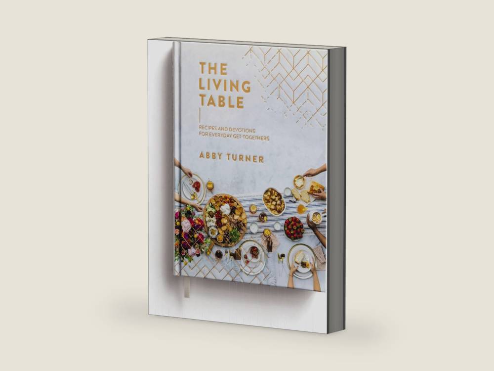 The Living Table: Recipes and Devotions for Everyday Get-Togethers (A Hospitality Cookbook with 90+ Delicious Meals, Appetizers, Snacks, and Drinks plus a Devotional for Every Occasion) by Abby Turner | barcode:9781644548493 | source:'9781644548493-right-three-quarter.jpg
