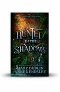 BestBuyBook cover of Hunted in the Shadows by Mary Dublin featuring dark forest imagery and a glowing green gemstone.