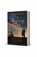 BestBuyBook paperback cover of In Darkness, Look for Stars by Clara Benson featuring a silhouette of a couple in Paris