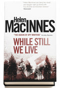BestBuyBook edition of While Still We Live by Helen Macinnes featuring a forest landscape cover design